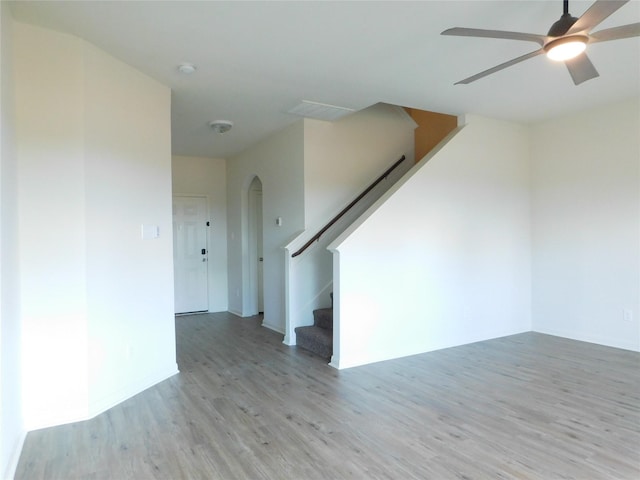 unfurnished room with ceiling fan and light wood-type flooring