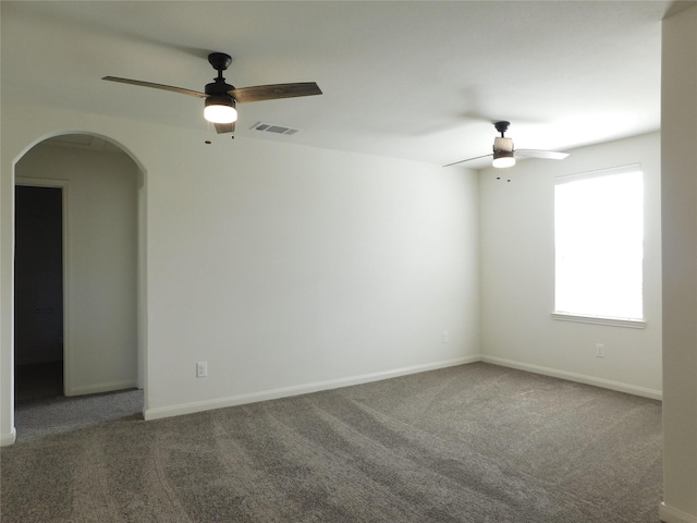 carpeted spare room with ceiling fan