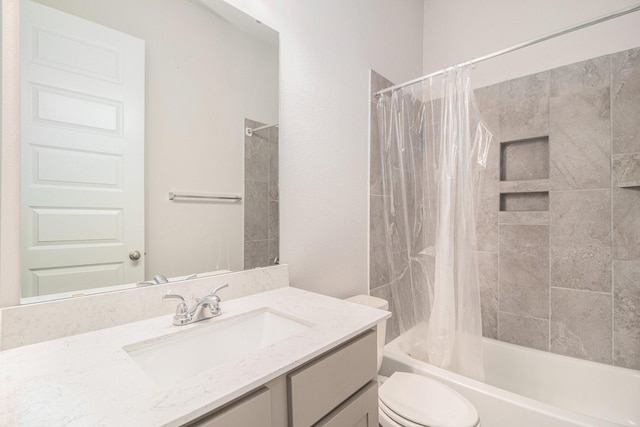 full bathroom with vanity, shower / tub combo with curtain, and toilet