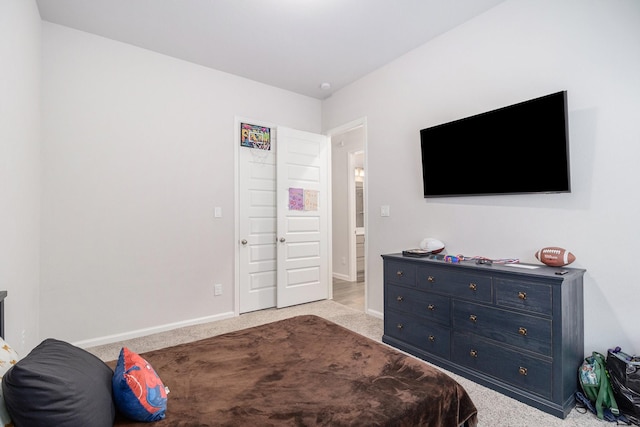 bedroom featuring light carpet