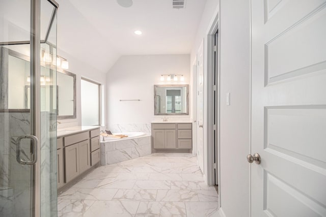 bathroom with independent shower and bath, vanity, and lofted ceiling