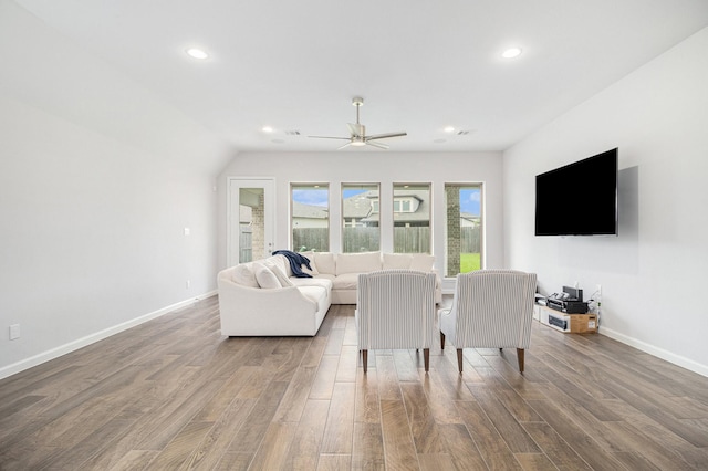 living room with hardwood / wood-style flooring and ceiling fan