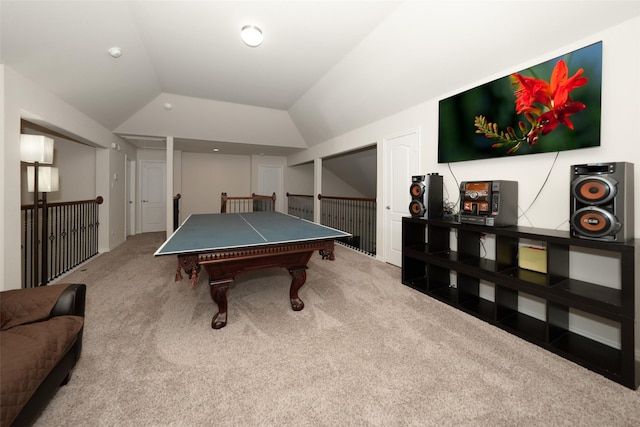 recreation room featuring carpet floors and vaulted ceiling