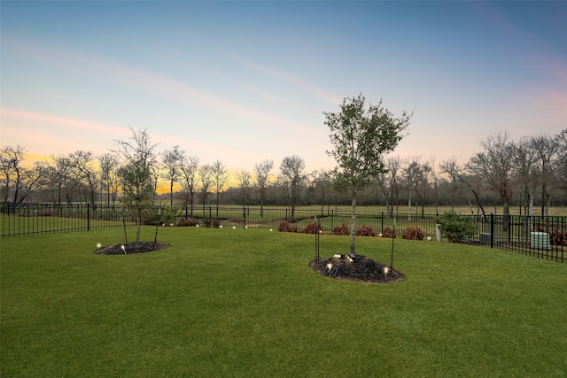 yard at dusk with a rural view