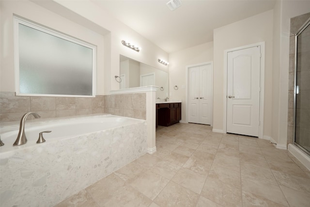 bathroom featuring vanity and separate shower and tub