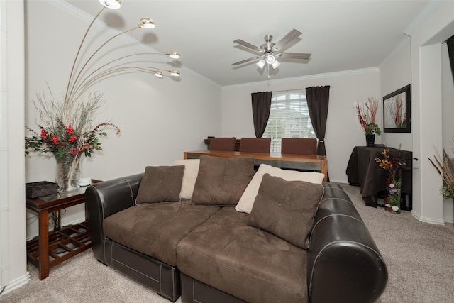 carpeted living room with ornamental molding and ceiling fan