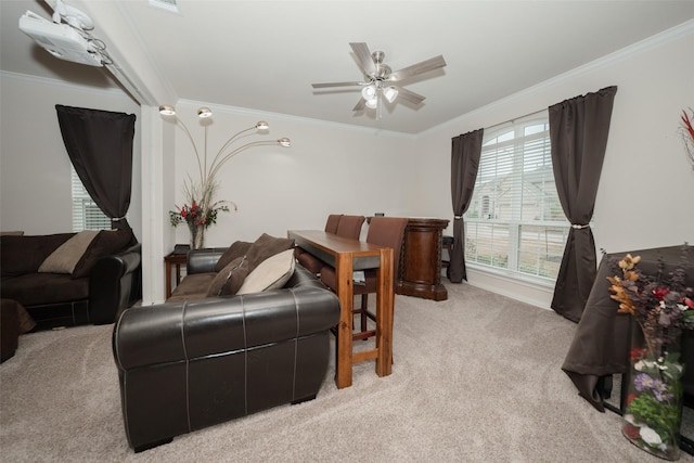 living room featuring crown molding, light colored carpet, and ceiling fan