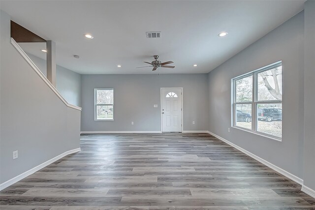 interior space featuring hardwood / wood-style flooring, a wealth of natural light, and ceiling fan