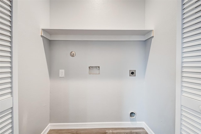 laundry room with hardwood / wood-style flooring, gas dryer hookup, hookup for a washing machine, and hookup for an electric dryer