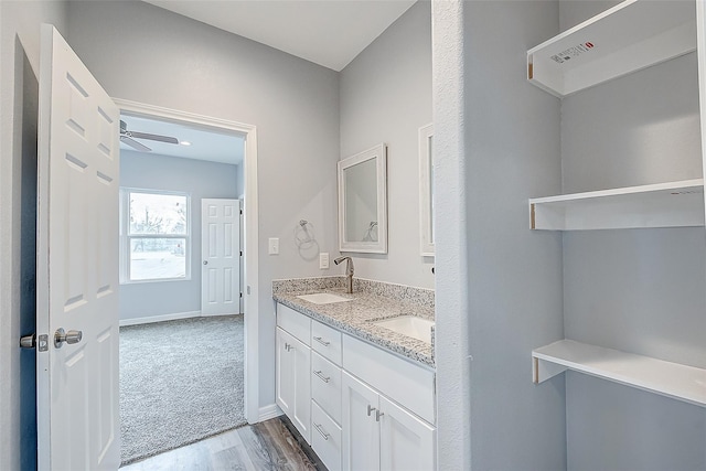 bathroom with vanity, wood-type flooring, and ceiling fan