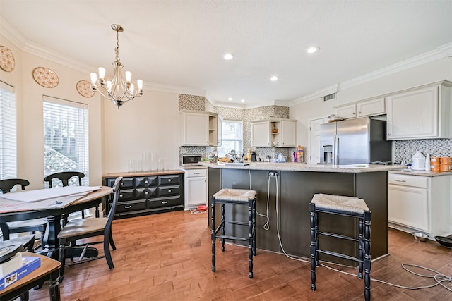 kitchen with open shelves, white cabinets, and stainless steel appliances