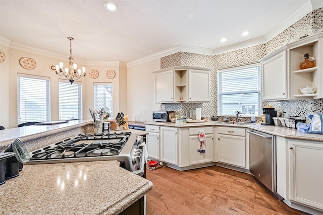 kitchen featuring stainless steel appliances, crown molding, and open shelves