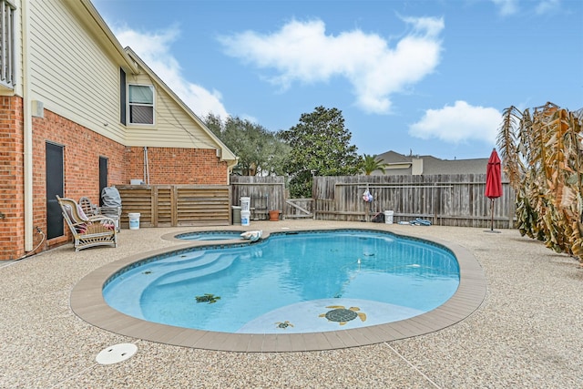 view of swimming pool with a fenced backyard, a fenced in pool, an in ground hot tub, and a patio