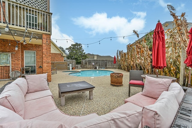 view of pool featuring a fenced backyard, a fenced in pool, an outdoor hangout area, and a patio