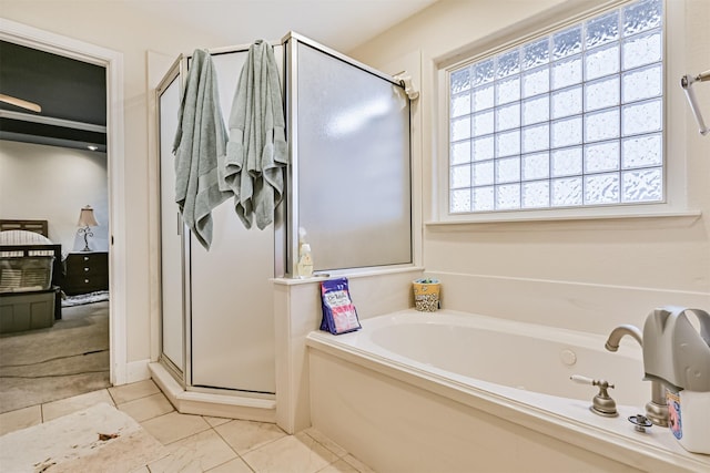 bathroom with a garden tub and a shower stall