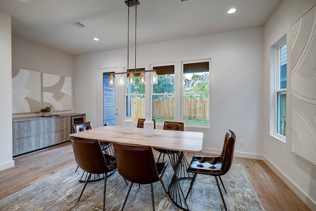 dining area with light hardwood / wood-style flooring