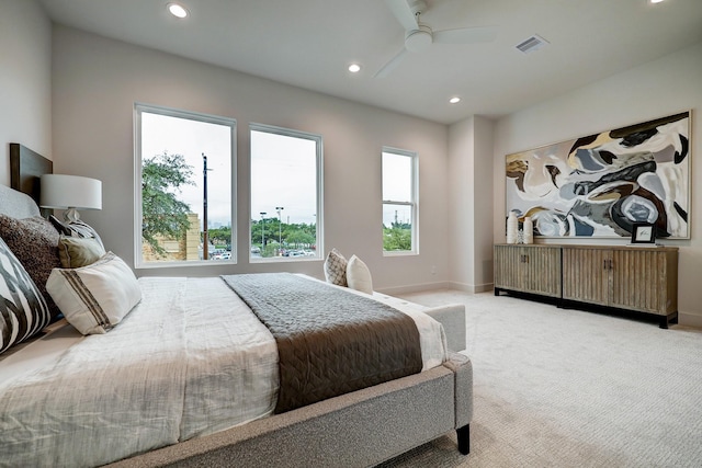 bedroom with light colored carpet and ceiling fan