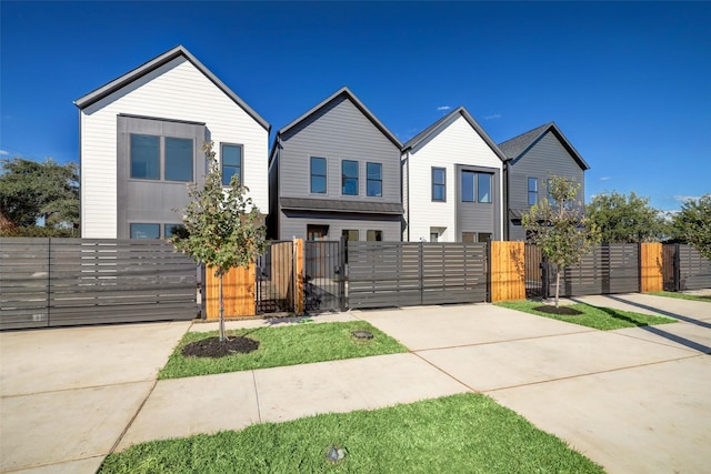 5215 Texas St, Houston, TX 77011 - view of front of home with a gate, driveway, and a fenced front yard