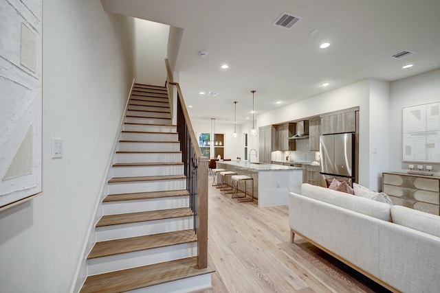 5215 Texas St, Houston, TX 77011 - staircase featuring wood finished floors and recessed lighting