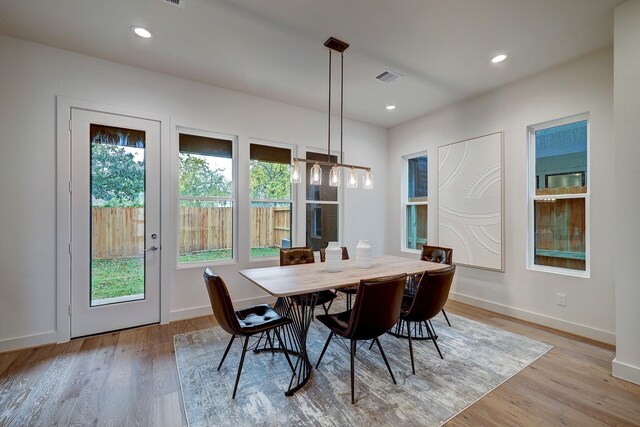 5215 Texas St, Houston, TX 77011 - dining room featuring light wood-type flooring, baseboards, and recessed lighting