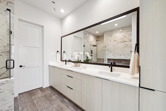 bathroom featuring vanity and a shower with shower door