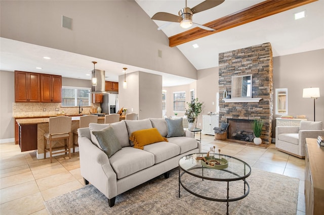 tiled living room with beam ceiling, a fireplace, high vaulted ceiling, and ceiling fan