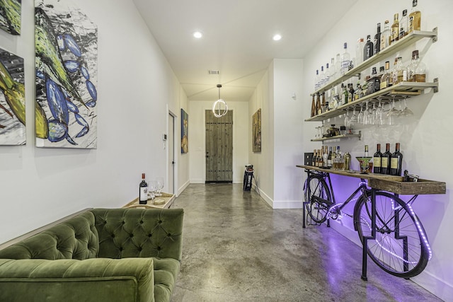 bar featuring concrete flooring