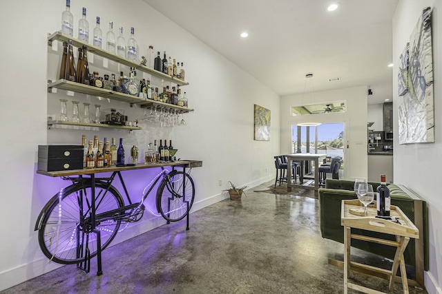 bar featuring concrete floors