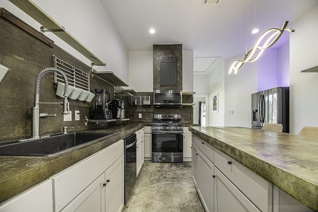 kitchen with tasteful backsplash, appliances with stainless steel finishes, sink, and white cabinets