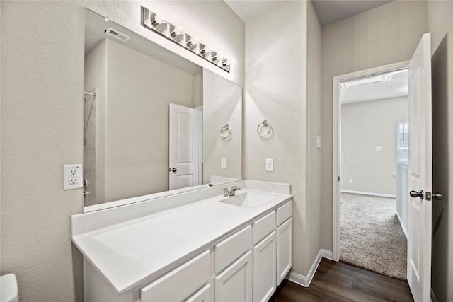 bathroom featuring vanity and wood-type flooring