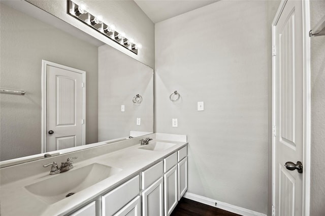 bathroom with vanity and hardwood / wood-style floors