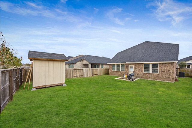 back of house with a patio and a yard