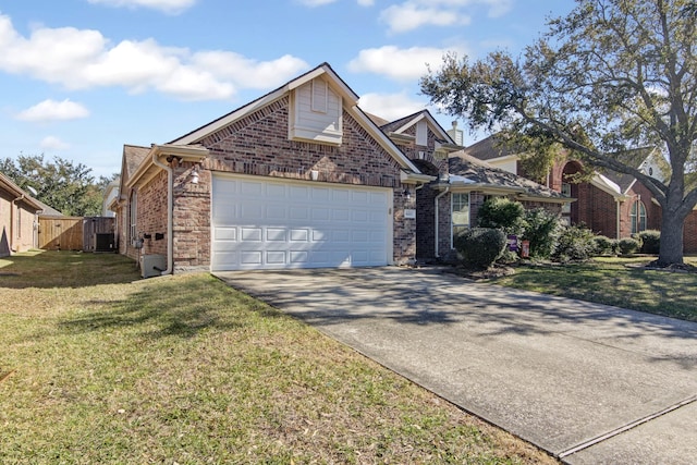 front of property featuring a garage, a front yard, and central AC unit