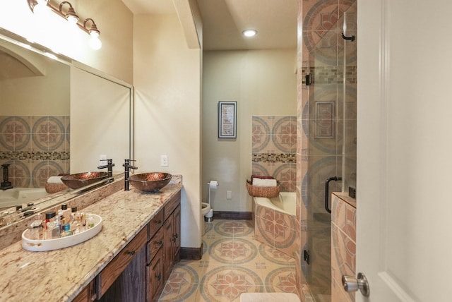 full bathroom with vanity, tile patterned floors, shower with separate bathtub, and toilet