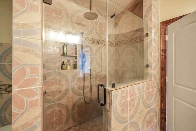 bathroom with a shower with shower door