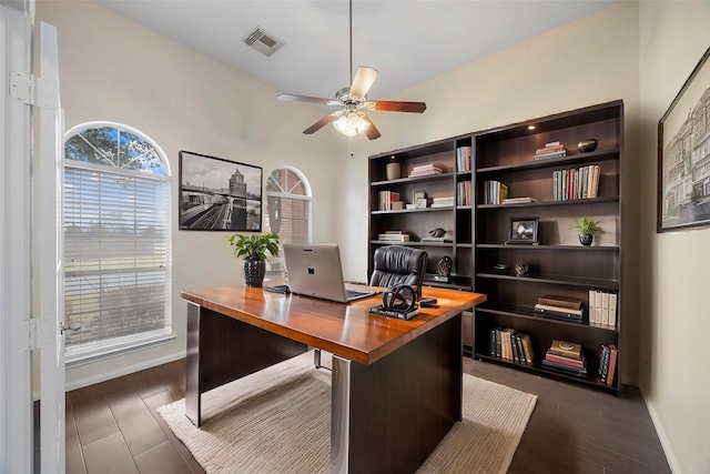 office area featuring dark hardwood / wood-style flooring and ceiling fan