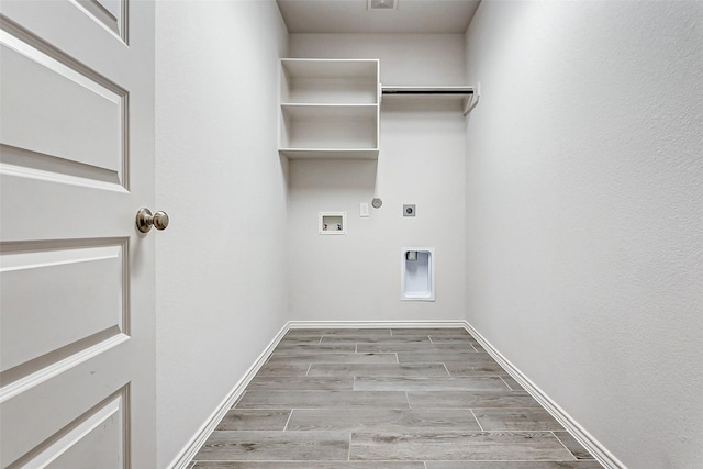 clothes washing area with washer hookup, hookup for a gas dryer, and hookup for an electric dryer