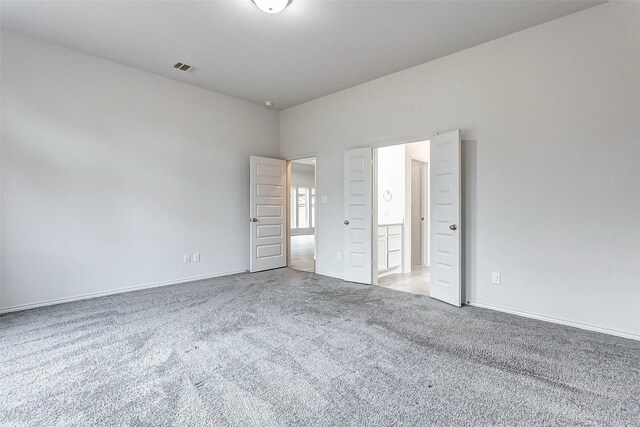 unfurnished bedroom with carpet