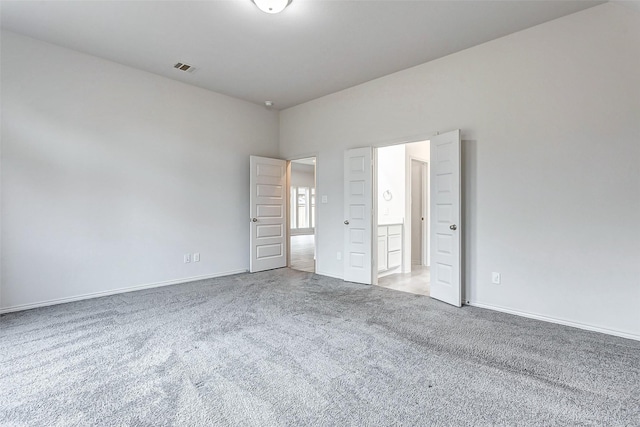 unfurnished bedroom featuring carpet