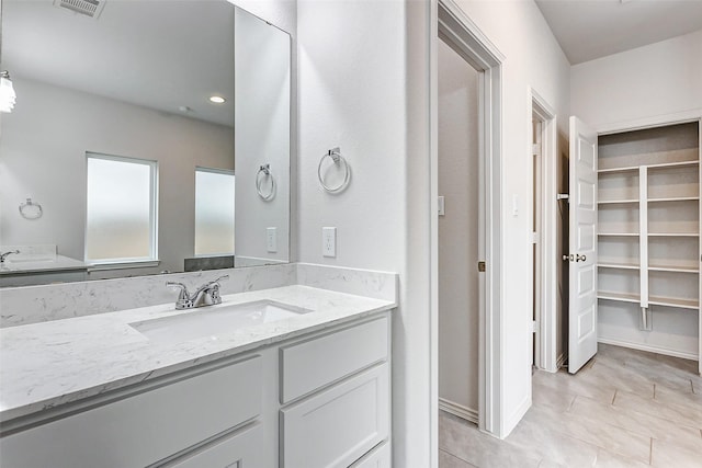 19723 Sandstone Bluff Way, Cypress, TX 77433 - bathroom with tile patterned floors, vanity, and visible vents