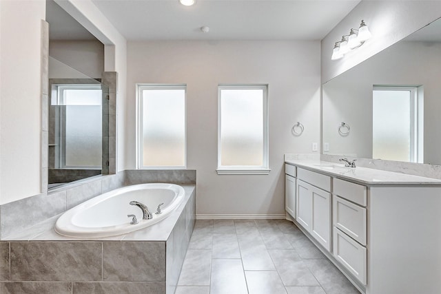 bathroom with vanity, tile patterned flooring, and separate shower and tub