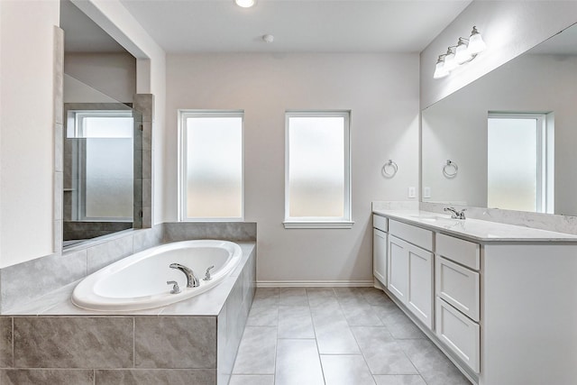 19723 Sandstone Bluff Way, Cypress, TX 77433 - full bath with tile patterned floors, vanity, baseboards, and a bath