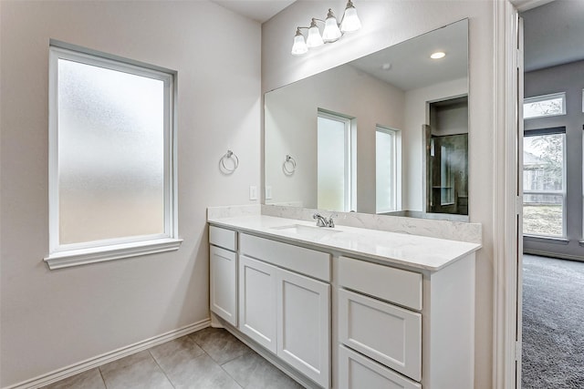 19723 Sandstone Bluff Way, Cypress, TX 77433 - bathroom featuring plenty of natural light, tile patterned floors, baseboards, and vanity