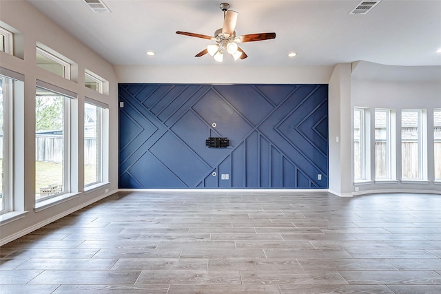 19723 Sandstone Bluff Way, Cypress, TX 77433 - unfurnished living room featuring ceiling fan, visible vents, and light wood finished floors