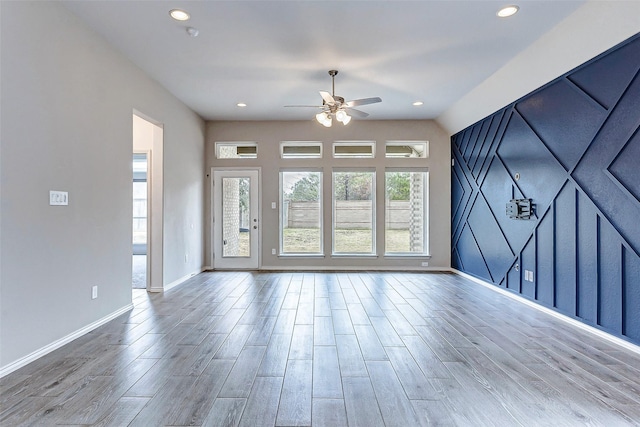 19723 Sandstone Bluff Way, Cypress, TX 77433 - unfurnished living room with a ceiling fan, recessed lighting, baseboards, and wood finished floors