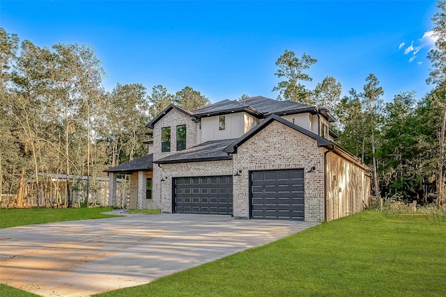 view of front of property with a garage and a front yard