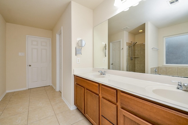 bathroom featuring vanity, tile patterned floors, and walk in shower