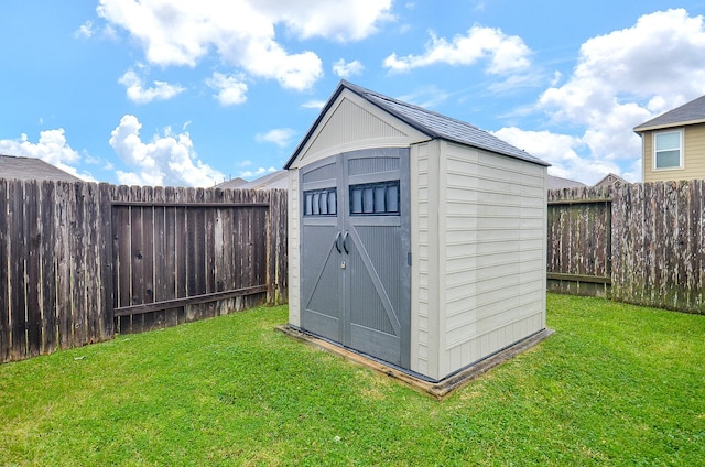 view of outbuilding with a yard