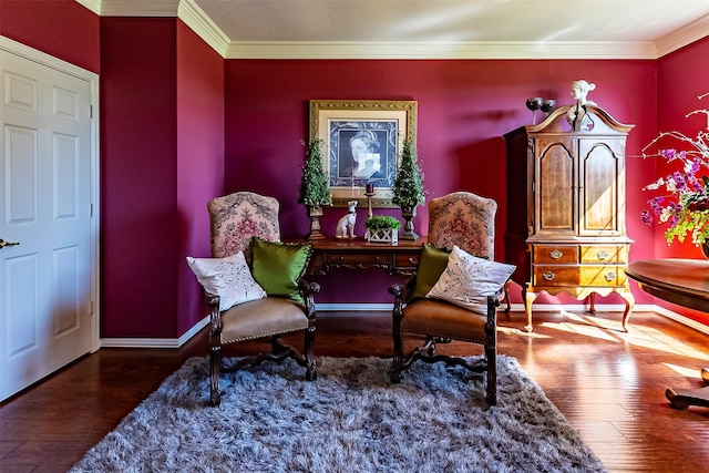 sitting room featuring crown molding and dark wood-type flooring