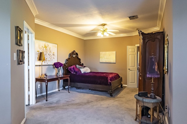 carpeted bedroom featuring crown molding and ceiling fan